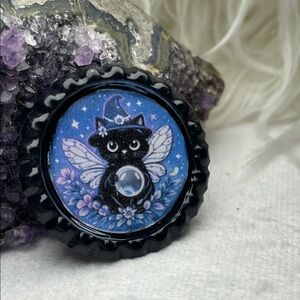 Black Cat Fairy Bottle Cap Pin Or Broach with Blue Background